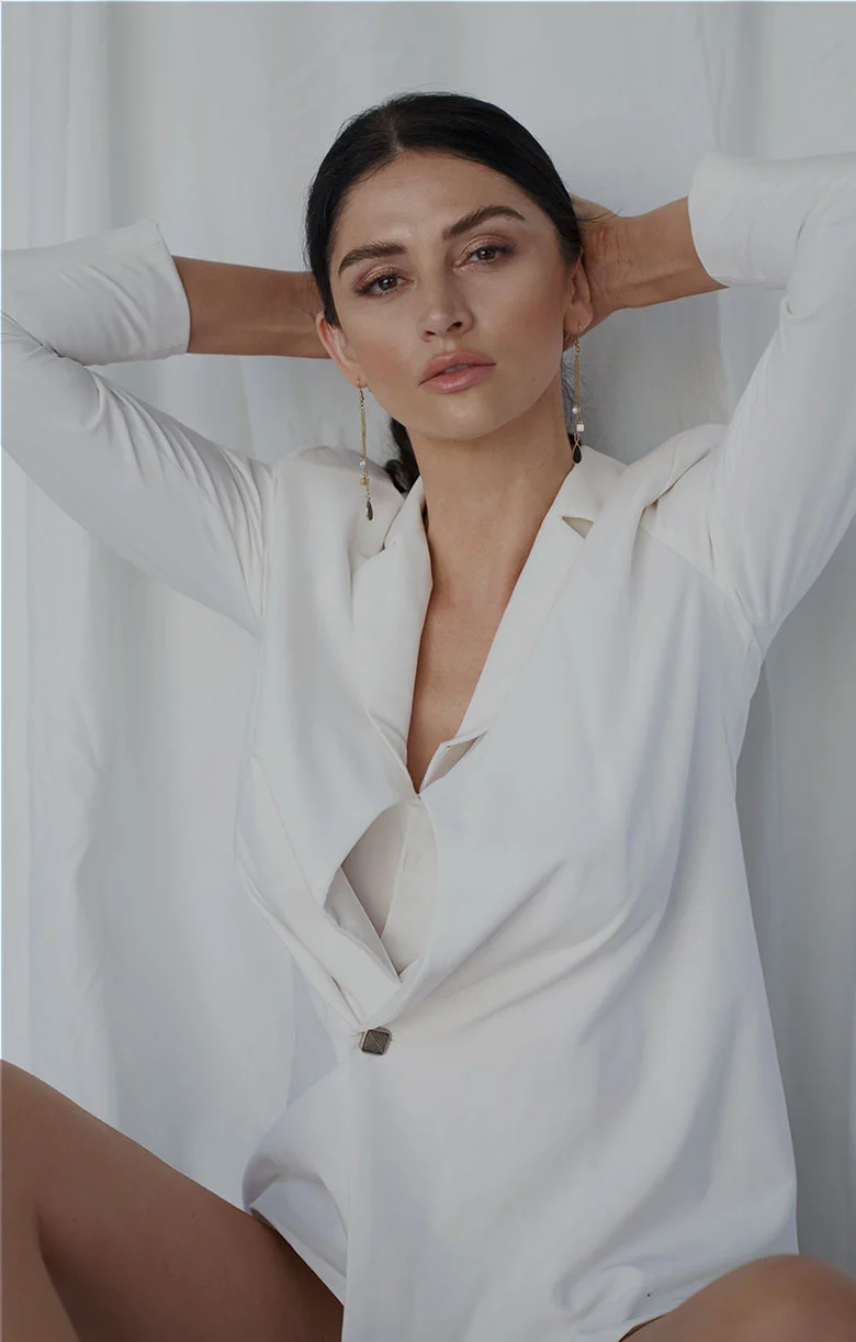 Editorial portrait of a woman in a white outfit from Las Vegas Body Sculpting; model image